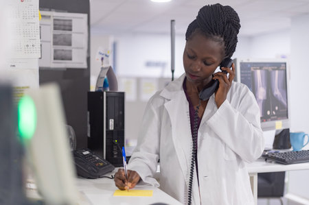 Close up of medical officer speaking on the phone in a hospitalの写真素材