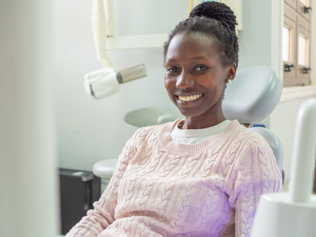 Young female patient at a dentist clinic looking at cameraの写真素材