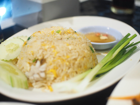 Fried rice with bright colors on a white plateの写真素材