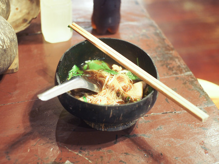 Noodles in a coconut shellの写真素材