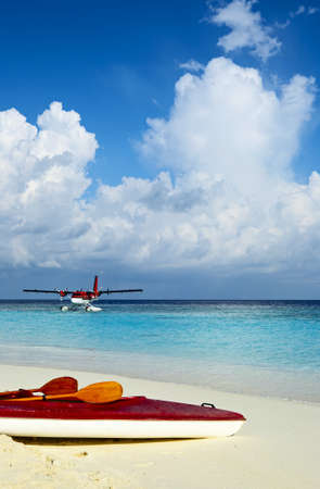 Paddle red boat is on a sandy beachの写真素材