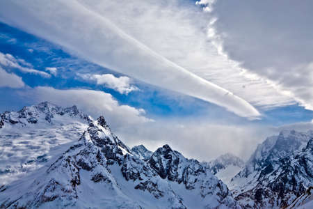 Tremendous clouds above the rock, Russia, Dombay