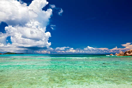 Dream seascape view with a big stones and palmtree, Seychelles, La Digue islandの写真素材