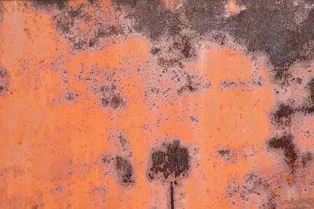 Painted metal with cracks in the paint, roughness, rust. Iron sheet covered with old paint, which...