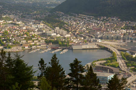 Lovely view of the marina and the surrounding cityscape in the distance from Mount Floyen in Bergen, Norway.の写真素材