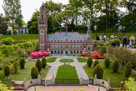 The Hague, Netherlands - 20th May, 2017: Tourists admiring the beauty of these miniature buildings that represent the famous life size landmarks of the Netherlands at Madurodam in The Hague, Netherlands. Selective focus.のeditorial素材
