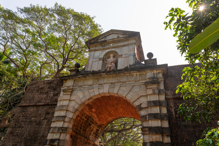 Old Goa, India - 19 December, 2022 : Statue of Vasco Da Gama in the middle of the Viceroy's Arch on the side facing the river and built in honor of him in 1599, by his grandson Fransisco da gama.のeditorial素材