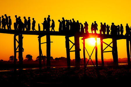 People On A Bridge At Sunsetの写真素材