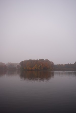 This picture shows a lake and fog.の写真素材