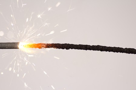 The picture shows a sparkler on white background .の写真素材