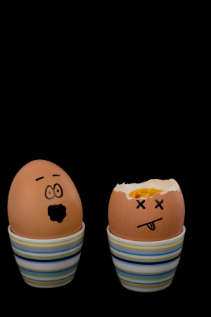 The picture shows an egg which shell is partial missing and an egg which is scared about that の写真素材