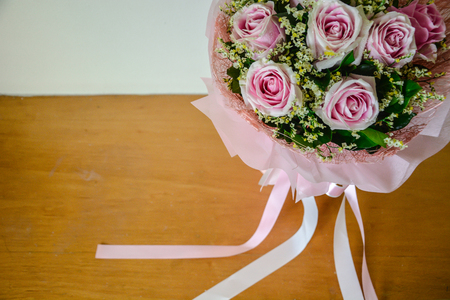 Pink rose bouquet and ribbon backgroundの写真素材