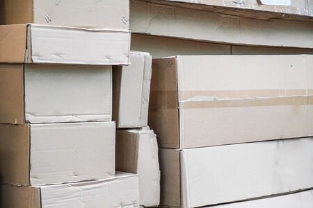 Background of courier paper boxes stacking on each otherの写真素材
