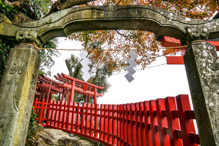 Perspective view of Japanese traditional red Tori arch through old gate arch at Yutoku Inari Shrineのeditorial素材