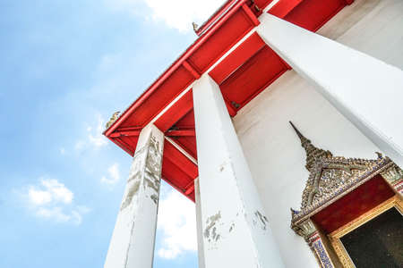 Beautiful Thai temple pavilion under bright clear blue sky of Kanlayanamit temple, Bangkok, Thailand. Thai culture and buddhism religious backgroundの写真素材