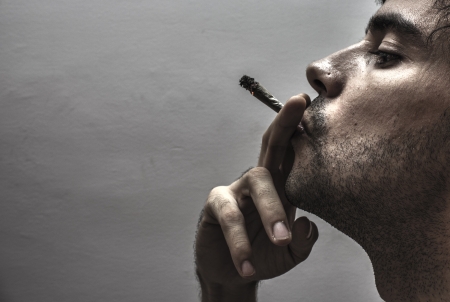 Profile of a person smokingの写真素材