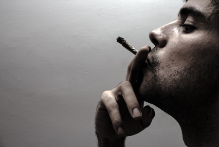Profile of a person smokingの写真素材