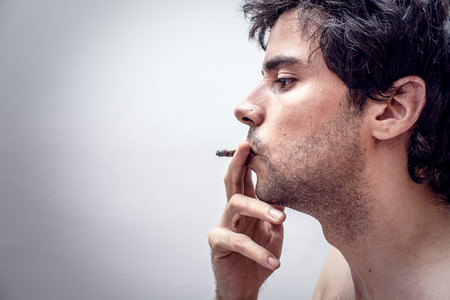 Profile of a person smoking の写真素材