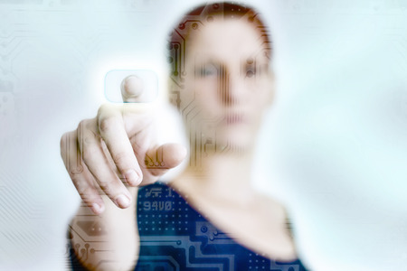 Woman pressing a touch panelの写真素材