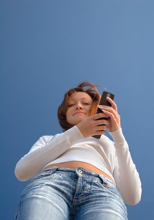 Girl with a mobile phone-2の写真素材