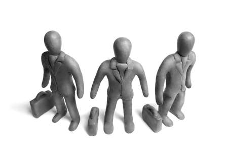 Figures of  plasticine businessmen on a white backgroundの写真素材
