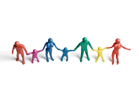 Multicolored plasticine human figures in a row on a white backgroundの写真素材