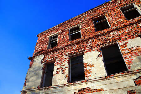 Ruined house on a background of  blue skyの写真素材