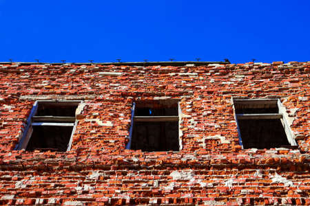 Ruined house on a background of  blue skyの写真素材