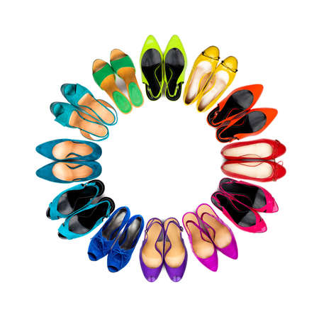 Set of multicolored female shoes arranged in frame on white background の写真素材