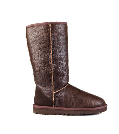 Brown ugg boot on white background.