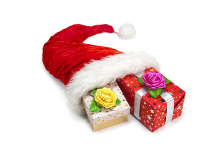 Santa's hat and  gift boxes inside on white background