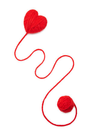 Red wool hearts on white background
