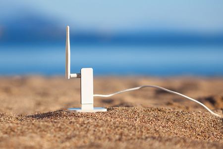 Wifi modem on a beachの写真素材