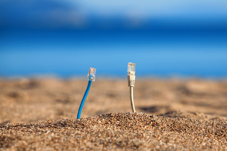 Internet cables on a beachの写真素材