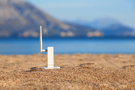 Wifi modem on a beachの写真素材