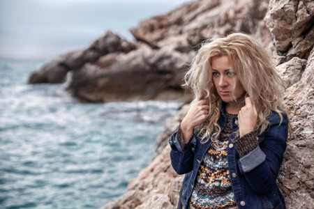 Sad woman on a seaside