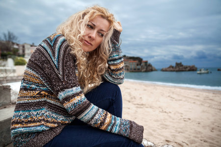 Sad woman on a seasideの写真素材