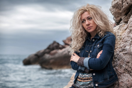 Sad woman on a seaside