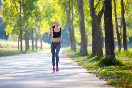 Jogging woman with a bottle of water