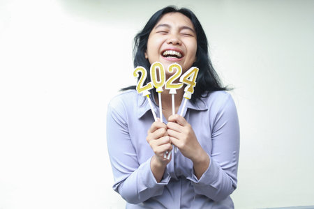 happy asian young woman wear grey formal suit laughing with closed eye and lifting arm hold 2024...