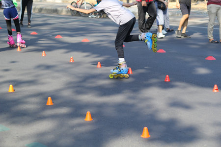 group of kids playing roller skates in park streets