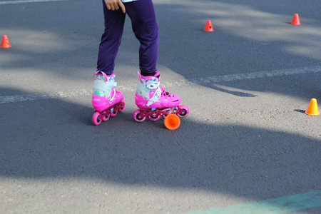 group of kids playing roller skates in park streets