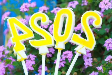 yellow candle number 2024 over purple flower, 20 24 new year eve background conceptの写真素材