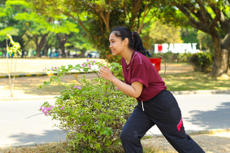 relax asian woman jogging in midday in outdoors, female running to practice cardio