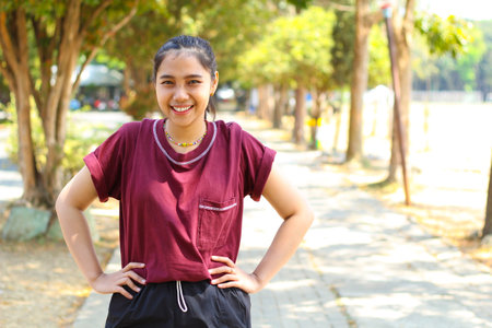 relax asian woman jogging in midday in outdoors, female running to practice cardioの写真素材