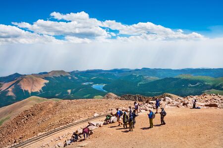 Colorado Springs, Colorado/USA - July 11 2016. People hiking on top of  Pikes Peak in Pike National Forest on summer day. Hikers enjoying beautiful summer mountain view with lake.のeditorial素材