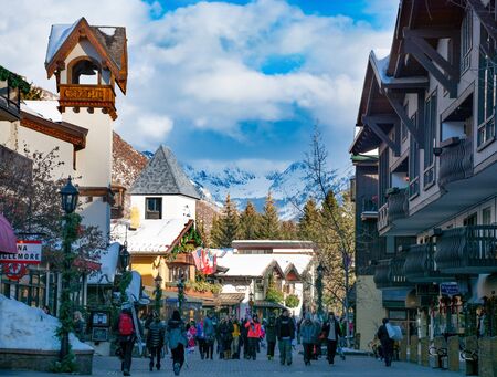 Vail, Colorado/USA-December,30,2018. Vail village,small town at base of Vail Mountain,gateway for winter sports. People walking next to stores and restarants,mountains in background.のeditorial素材