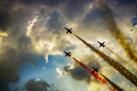 Aerobatics in the sky with clouds at the airshowの写真素材