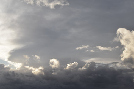 Dramatic morning sunrise dark cloudy sky. Stormy rainy season sky. Beautiful nature.