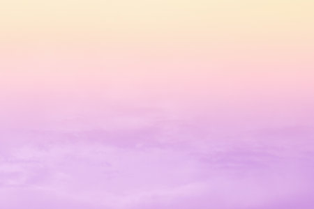 Purple golden yellow orange pastel sky with cloud. Soft light sunset background. Morning sunrise sky background.の写真素材